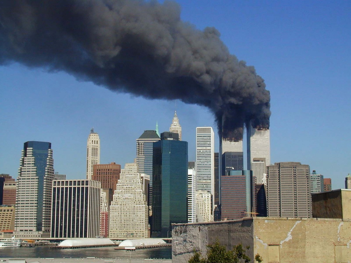 Smoke pouring from the World Trade Center towers above the Manhattan skyline on the morning of September 11, 2001